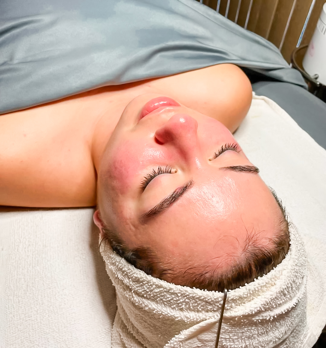 Young lady receiving a facial at Studio One Salon and Spa in Dekalb, IL.